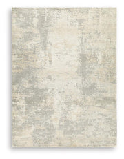 Ashley Furniture Raif Rug in soft woven design, featuring neutral colors and textured surface for cozy home decor.