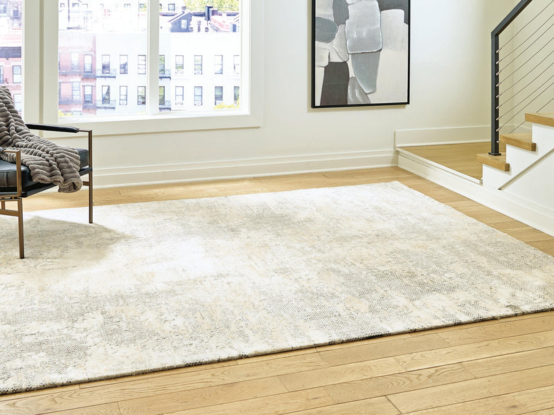 Ashley Furniture Raif Rug with intricate patterns, rectangular shape, in warm tones, showcasing detailed woven design.