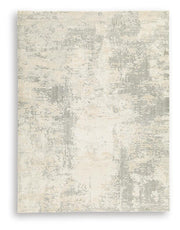 Ashley Furniture Raif Rug in neutral tones, plush woven rug with intricate pattern, ideal for living rooms or bedrooms.