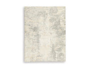 Ashley Furniture Raif Rug with intricate pattern in warm tones, showcasing soft woven texture and stylish design for living spaces.