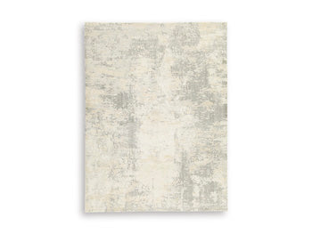Ashley Furniture Raif Rug with intricate pattern in warm tones, showcasing soft woven texture and stylish design for living spaces.