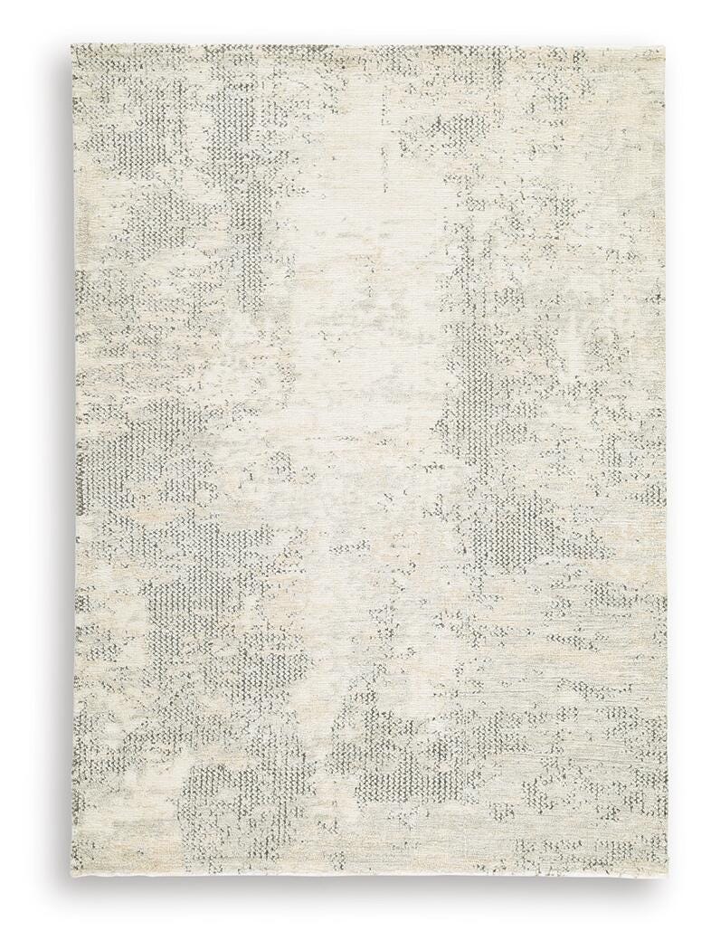 Ashley Furniture Raif Rug with intricate pattern in neutral tones, showcasing plush texture and stylish design for modern interiors.