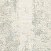 Ashley Furniture Raif Rug swatch featuring soft, woven fabric in neutral tones with subtle pattern details.