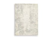 Ashley Furniture Raif Rug with intricate pattern, soft texture, and neutral tones, perfect for cozy living spaces.