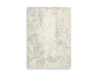 Ashley Furniture Raif Rug with intricate pattern, soft texture, and neutral tones, perfect for cozy living spaces.