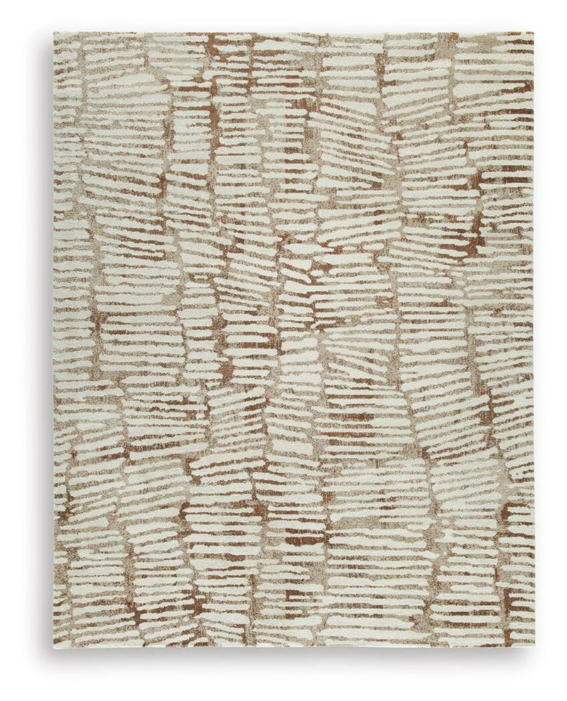 Ashley Furniture Uduak Rug in soft woven fabric with intricate patterns, ideal for adding warmth and style to living spaces.