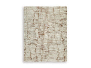 Ashley Furniture Uduak Rug with intricate patterns and neutral colors, showcasing a soft textured surface and detailed design.