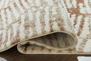 Close-up of Ashley Furniture Uduak Rug with intricate woven pattern and soft neutral tones, showcasing detailed craftsmanship.
