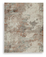 Ashley Furniture Jadenburg Rug featuring a soft, woven design in neutral tones, ideal for adding warmth to living spaces.