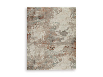 Ashley Furniture Jadenburg Rug with intricate pattern and warm tones, perfect for adding style to living room or bedroom decor.