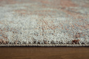 Close-up of the Ashley Furniture Jadenburg Rug showcasing intricate patterns and rich textures in neutral tones.