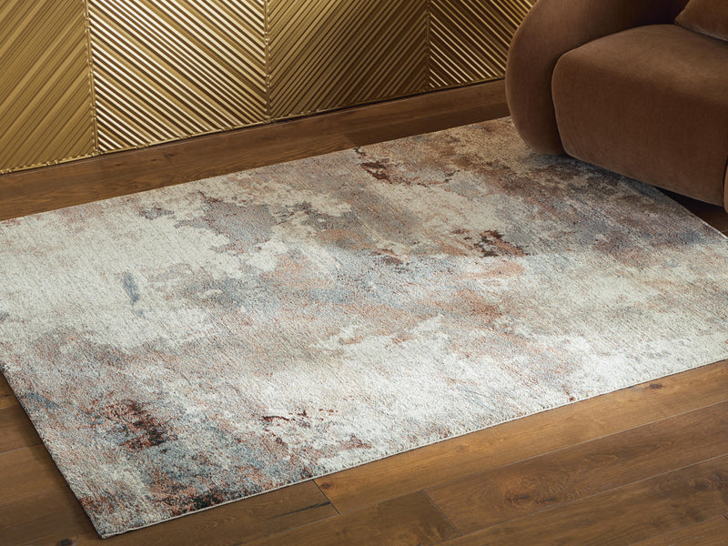 Ashley Furniture Jadenburg rug in a 4x3 cropped view, showcasing its textured design and neutral color palette.
