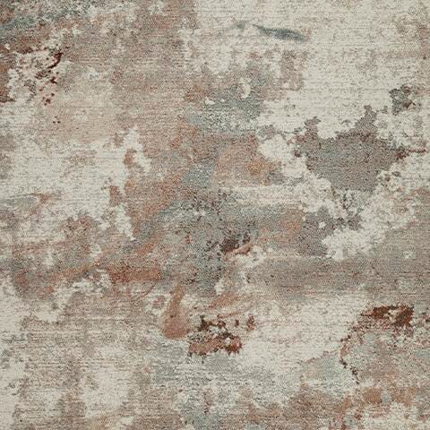 Close-up of the Ashley Furniture Jadenburg Rug featuring a textured, patterned design in neutral tones.