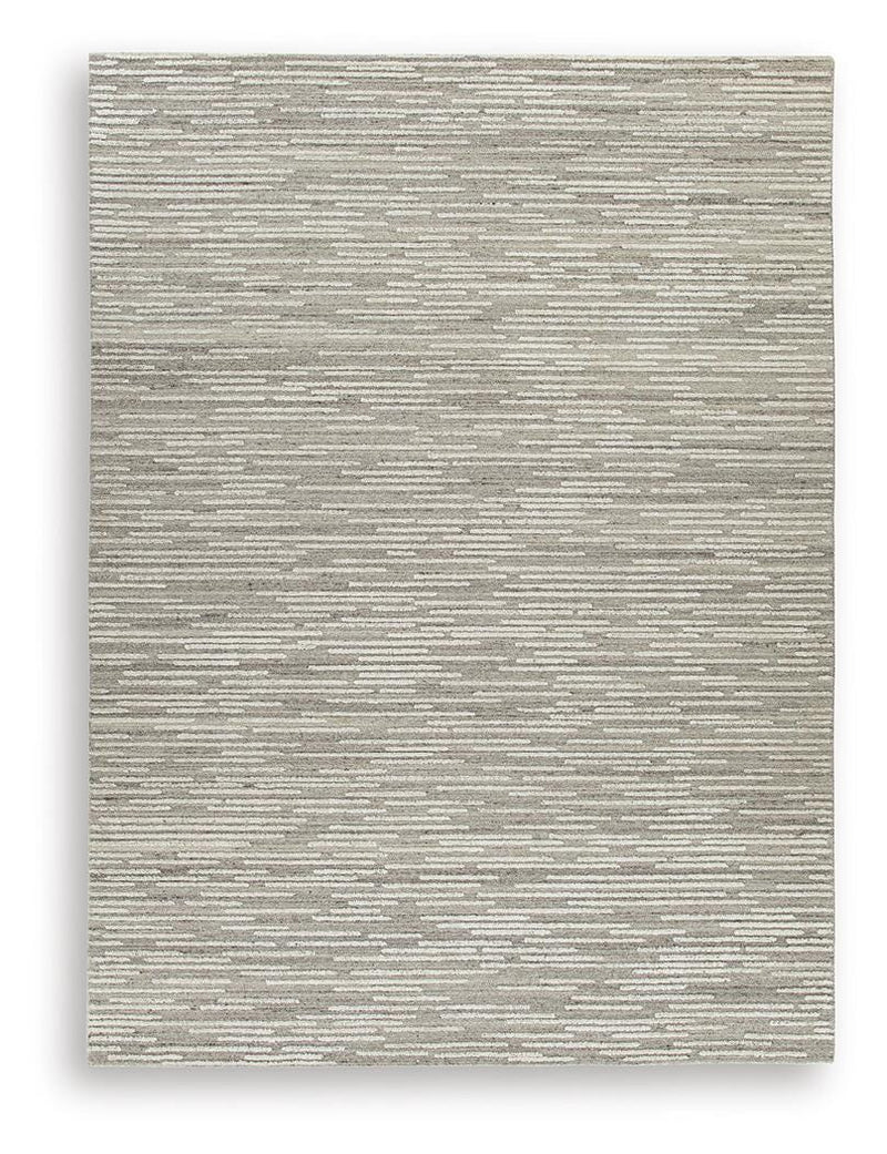 Ashley Furniture Eljory Rug with intricate patterns in warm tones, showcasing plush texture and detailed design.
