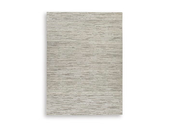 Ashley Furniture Eljory Rug with intricate patterns in warm tones, showcasing a soft textured surface.