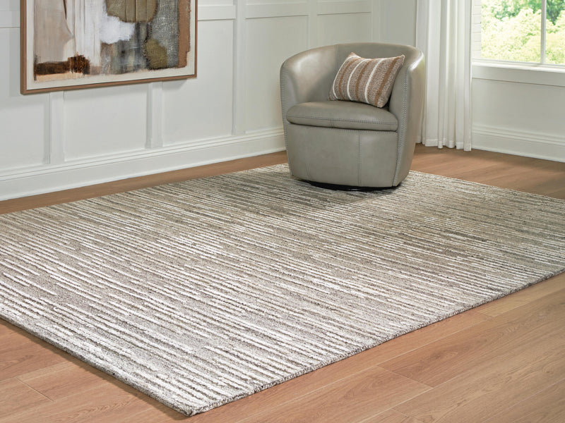 Ashley Furniture Eljory rug in a cropped view, showcasing its textured pattern and neutral color for living room decor.