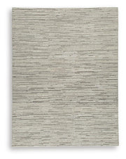 Ashley Furniture Eljory Rug featuring a soft, textured design with neutral tones, perfect for adding warmth to any room.