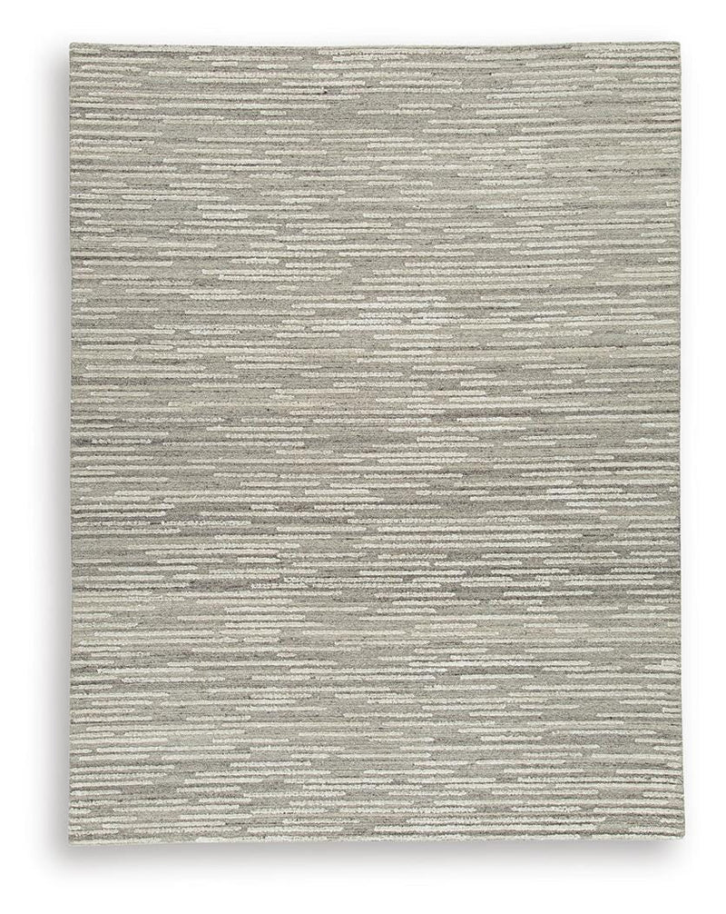 Ashley Furniture Eljory Rug featuring a soft, textured design with neutral tones, perfect for adding warmth to any room.