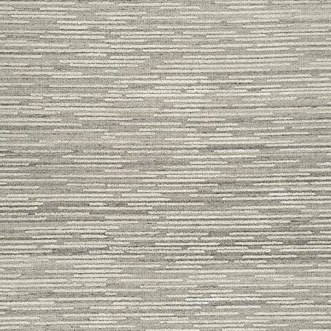 Swatch of Ashley Furniture Eljory Rug featuring a textured design in neutral tones, showcasing soft fabric and intricate pattern.