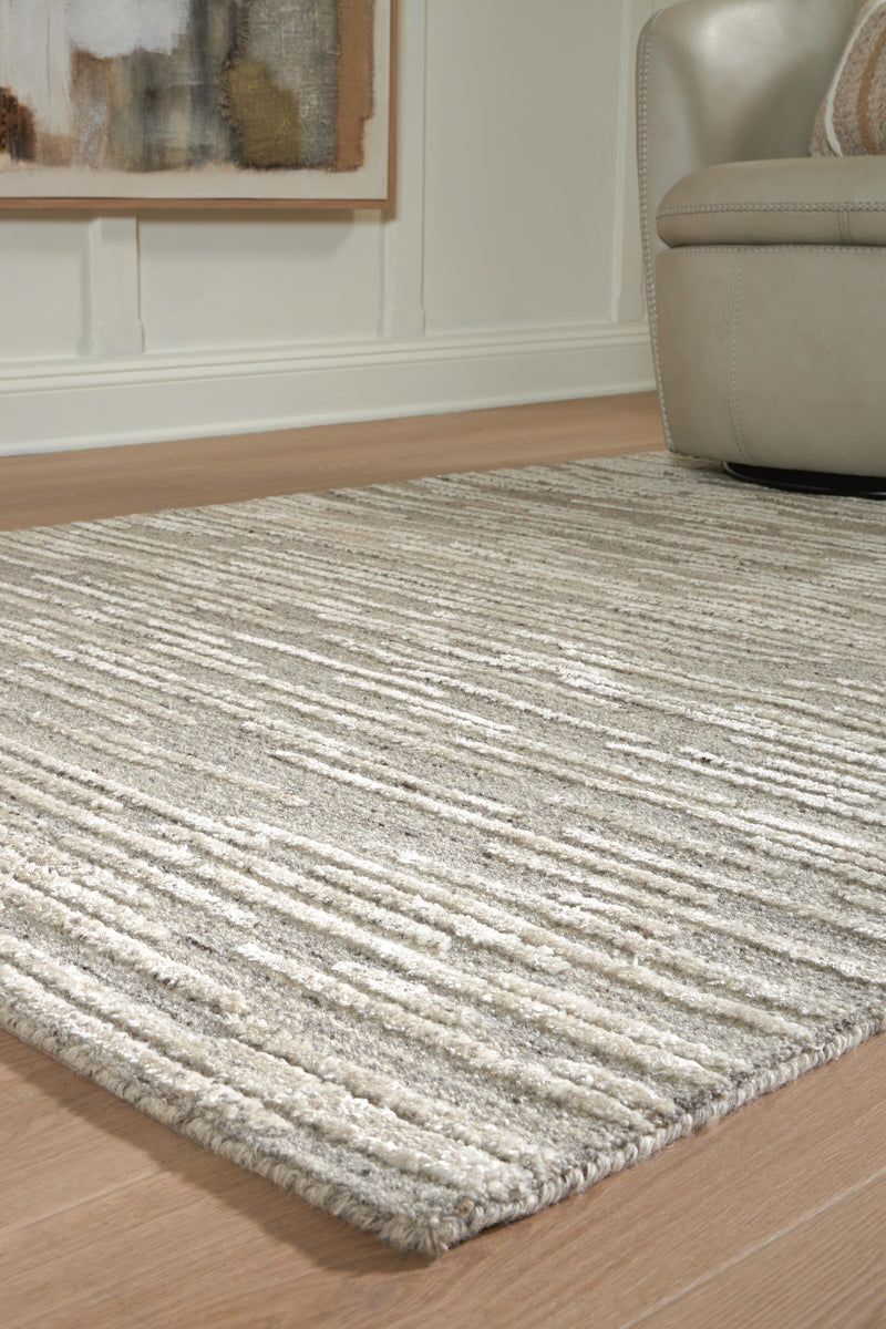 Close-up of the Ashley Furniture Eljory Rug showcasing intricate patterns and soft texture in a detailed view.