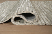 Close-up of the Ashley Furniture Eljory Rug showing its detailed woven pattern and soft texture in natural tones.