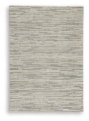 Ashley Furniture Eljory Rug with intricate patterns in neutral tones, showcasing its soft texture and stylish design.