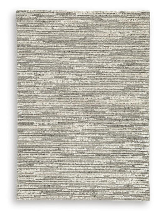 Ashley Furniture Eljory Rug with intricate patterns in neutral tones, showcasing its soft texture and stylish design.
