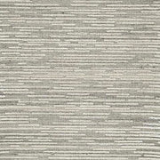 Ashley Furniture Eljory Rug swatch showing textured fabric with neutral beige and brown tones for cozy home decor