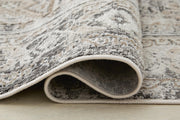 Close-up of the Ashley Furniture Junley Rug showing detailed woven texture and intricate patterns in neutral tones.