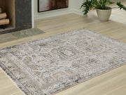 Ashley Furniture Junley Rug with a plush, textured surface in earthy tones, perfect for adding warmth to living spaces.