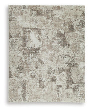 Ashley Furniture Barricland Rug with a textured pattern, featuring earthy tones and a plush, comfortable surface.