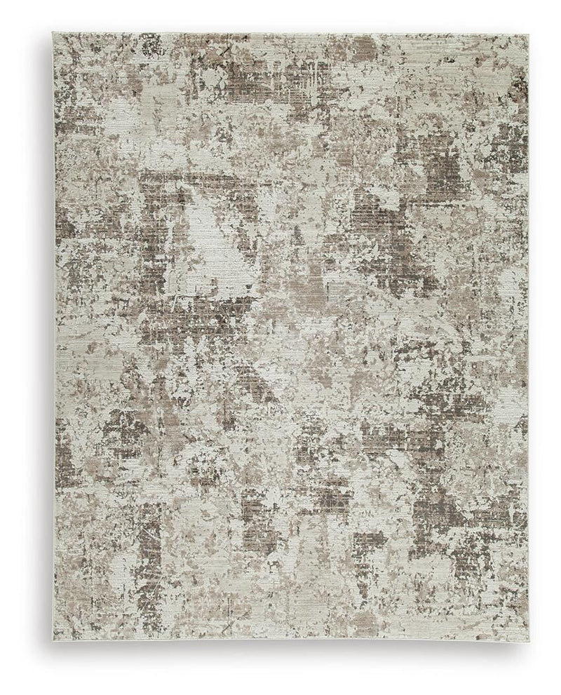 Ashley Furniture Barricland Rug with a textured pattern, featuring earthy tones and a plush, comfortable surface.