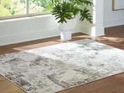 Ashley Furniture Barricland rug with intricate geometric patterns in neutral tones, perfect for living room or bedroom decor.