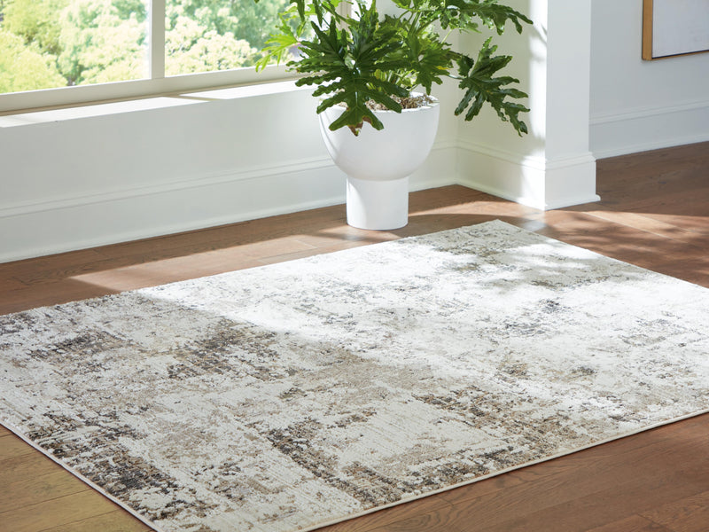 Ashley Furniture Barricland rug with intricate geometric patterns in neutral tones, perfect for living room or bedroom decor.