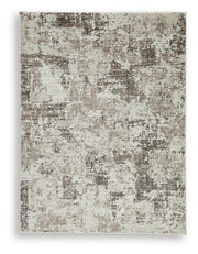 Ashley Furniture Barricland Rug with intricate pattern and warm tones, showcasing a soft, woven textile for living room decor.