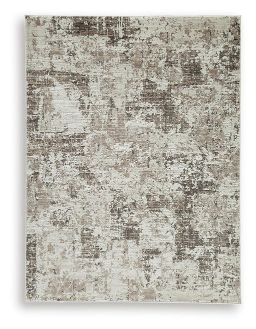 Ashley Furniture Barricland Rug with intricate pattern and warm tones, showcasing a soft, woven textile for living room decor.