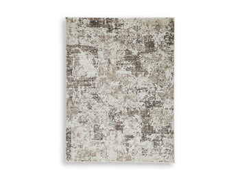 Ashley Furniture Barricland rug featuring a plush, patterned design with warm tones, ideal for enhancing living room decor.