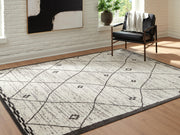 Ashley Furniture Fenriston Rug, 4x3 feet, featuring a textured pattern in neutral tones for cozy home decor.