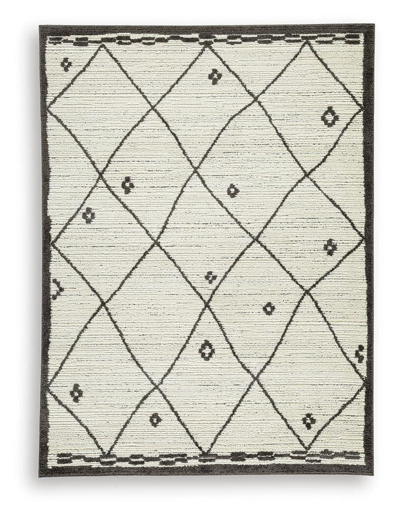 Ashley Furniture Fenriston Rug with intricate patterns in warm tones, showcasing soft, woven textile suitable for living rooms.