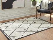 Ashley Furniture Fenriston Rug in neutral tones, close-up showing woven texture and intricate pattern on a soft, durable rug.