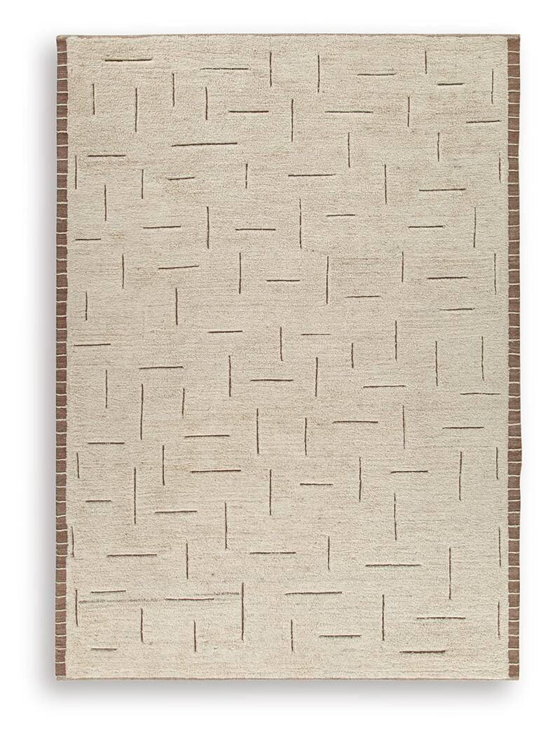Ashley Furniture Clayman Rug with textured pattern, soft neutral colors, and plush surface for cozy living room decor.