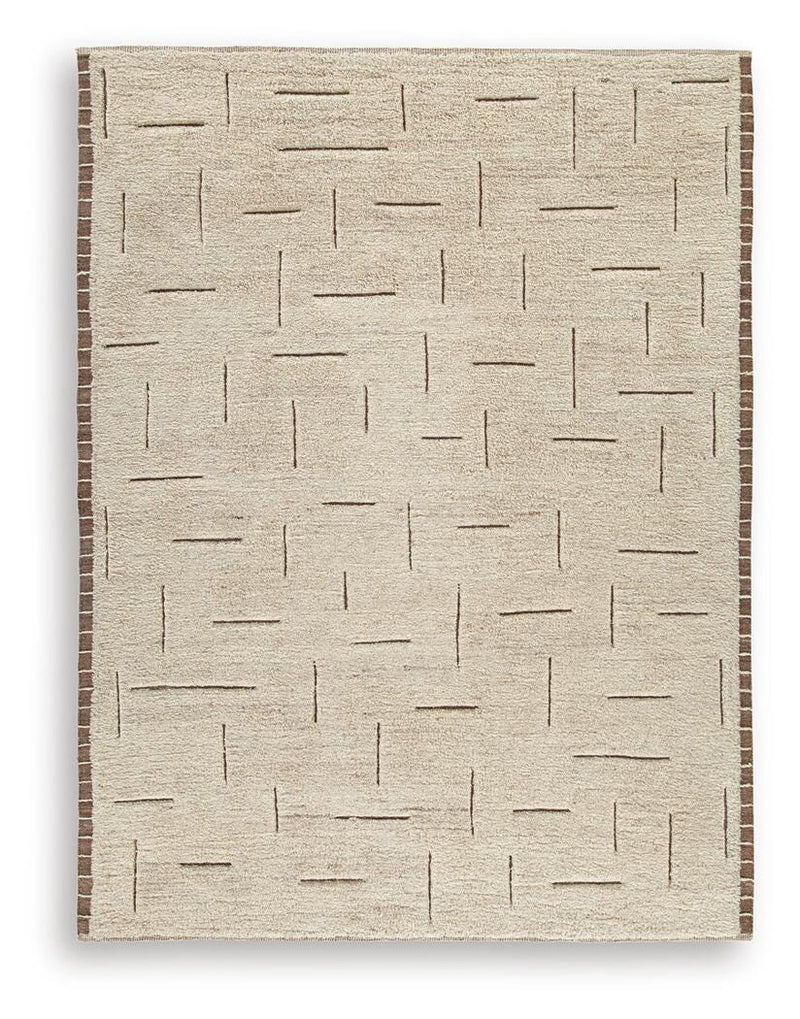 Ashley Furniture Clayman Rug featuring a textured geometric pattern in warm earthy tones.