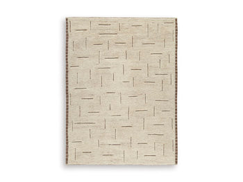 Ashley Furniture Clayman Rug featuring a textured, woven design in earthy tones, perfect for adding warmth to living spaces.