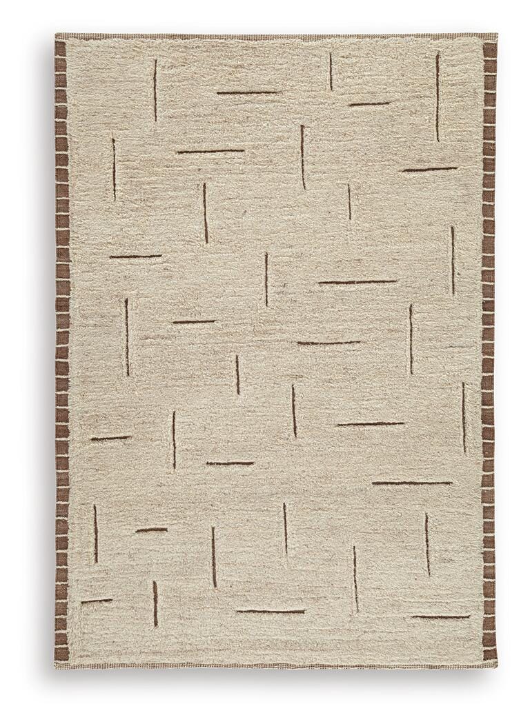 Ashley Furniture Clayman Rug with soft, textured design in warm earth tones, perfect for adding comfort to living spaces.