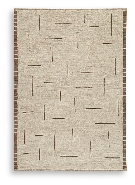 Ashley Furniture Clayman Rug with soft, textured design in warm earth tones, perfect for adding comfort to living spaces.