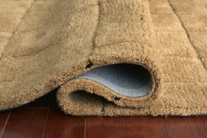 Close-up of Luzmont Rug by Ashley Furniture showing intricate woven patterns and soft texture in neutral tones.