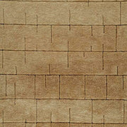 Swatch of Luzmont Rug by Ashley Furniture showing a textured fabric sample with neutral tones and intricate pattern details