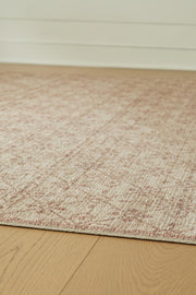 Close-up of the Ashley Furniture Lyamford Rug showcasing intricate woven patterns and rich textures in neutral tones.