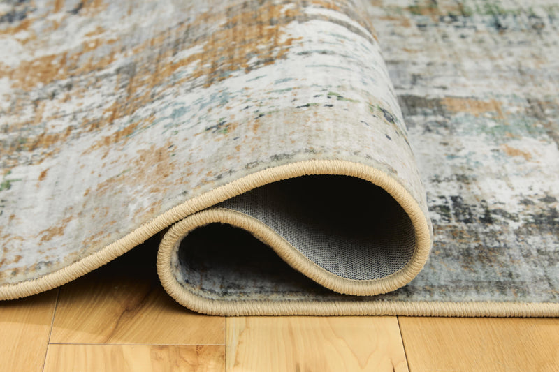 Close-up of the Ashley Furniture Torinette Rug with detailed pattern and soft texture, showcasing its elegant design and vibrant colors.