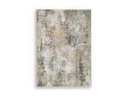 Ashley Furniture Torinette Rug with intricate patterns in neutral tones, showcasing a soft, plush texture for cozy living spaces.